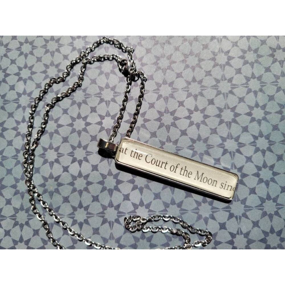 Court of the Moon pendant necklace made with These Hollow Vows book pages